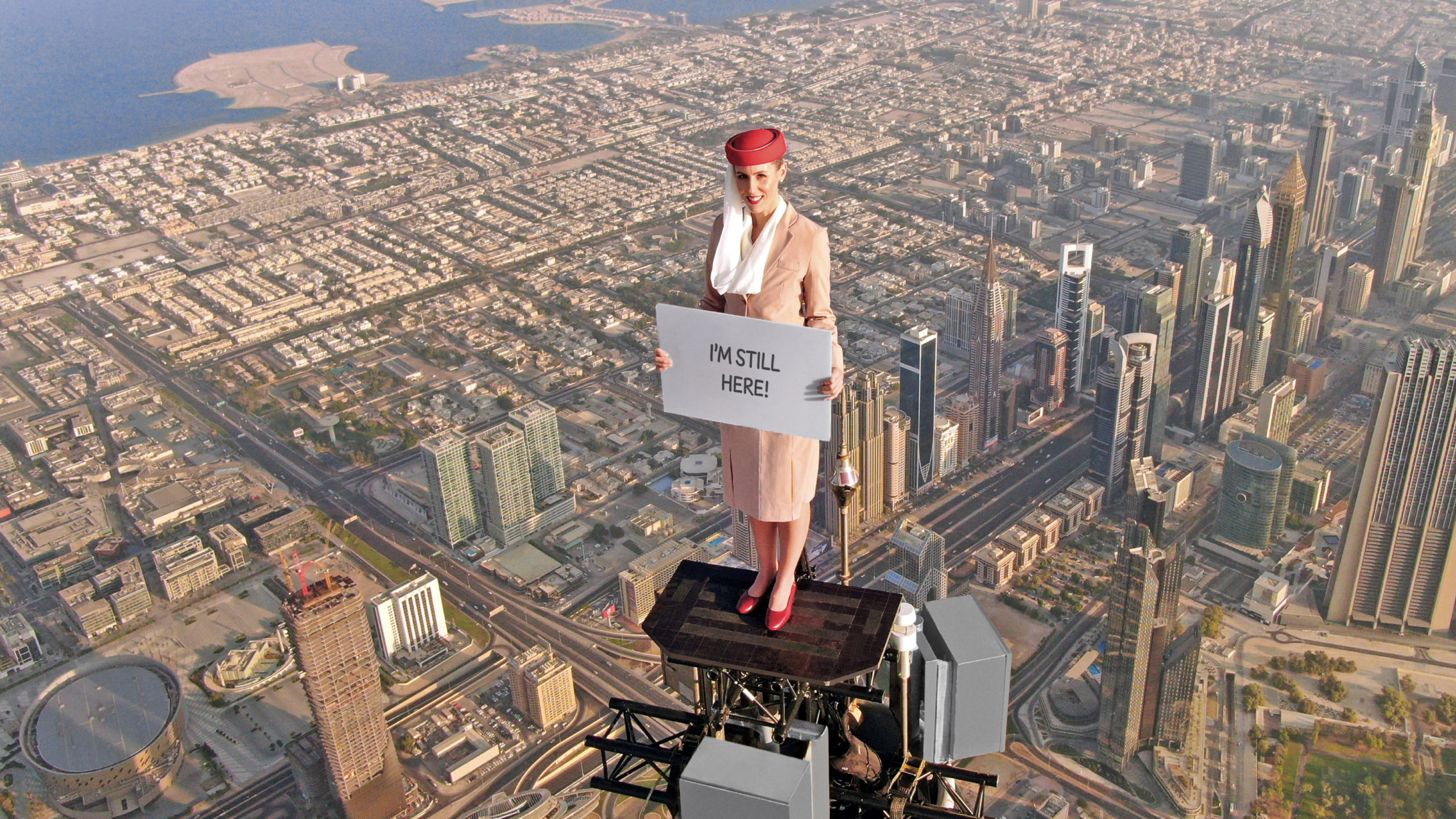 The brave stuntwoman is standing at the pinnacle of the Burj Khalifa by Emaar once again, holding up message boards with an invitation to visit Expo 2020 Dubai, on the iconic Emirates A380.